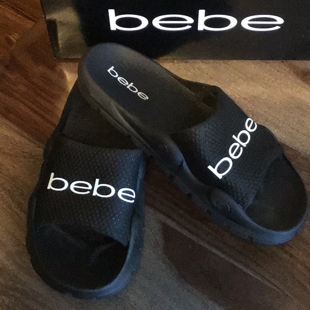 NEW “Bebe” black slip-ons